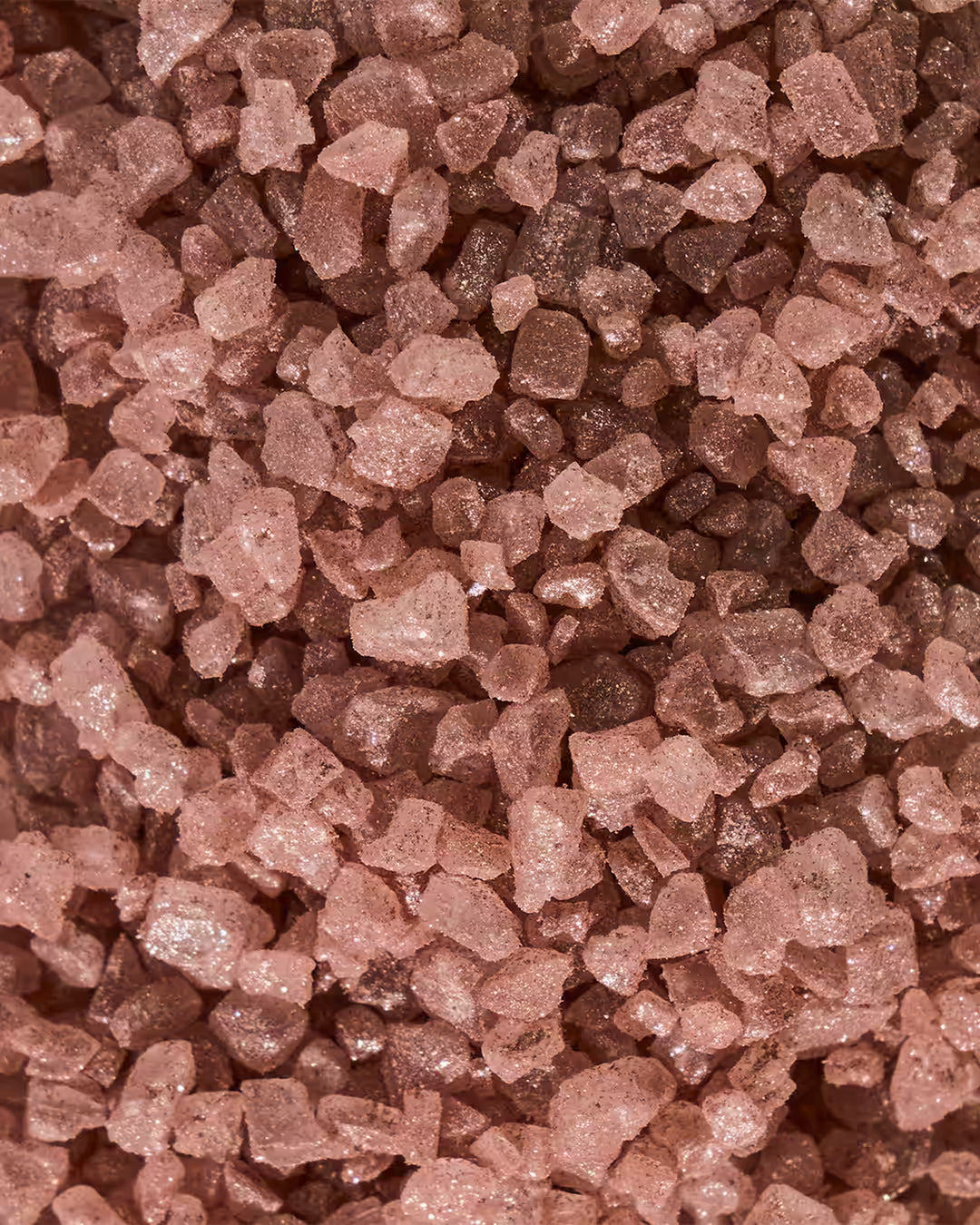 Textura do Sal de Banho Esfoliante Rosa de Luxo com partículas de brilho feito brasil para banho de banheira ou escalda-pés